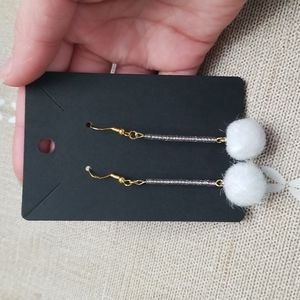 White pom-pom Earrings.